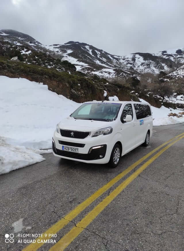 taxi minivan to omalos with snow